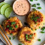 Tuna Cakes on a plate with a pot of Spicy Tartar