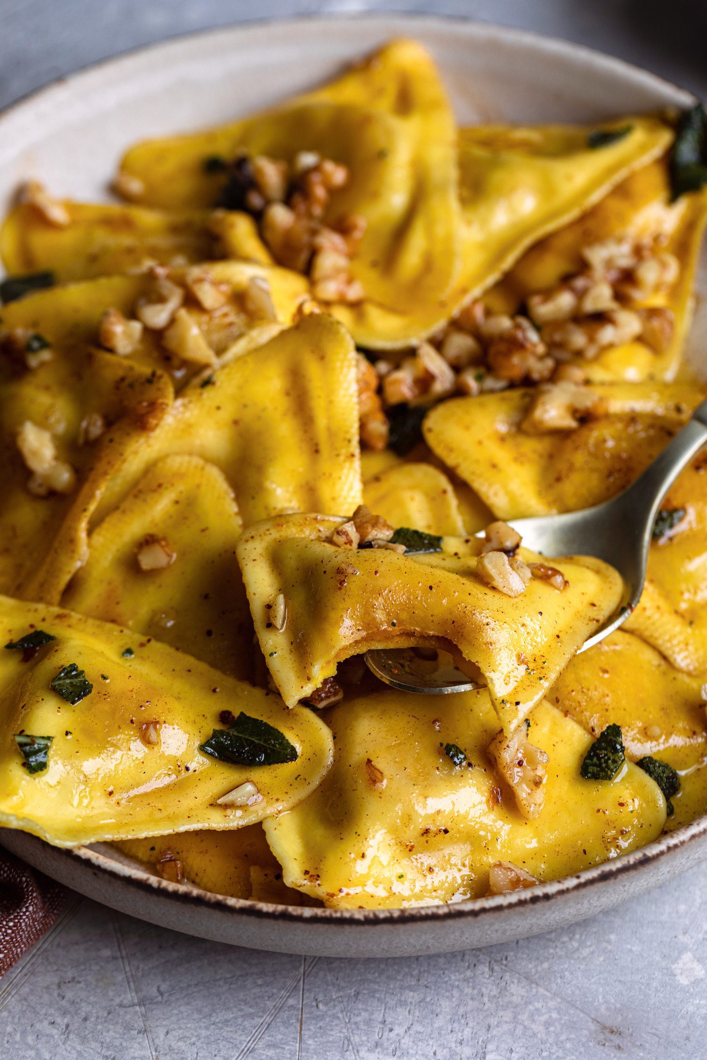 Trader Joe's butternut squash raviolis with a sage nutmeg butter sauce and toasted walnuts make for the perfect cozy and comforting meal!