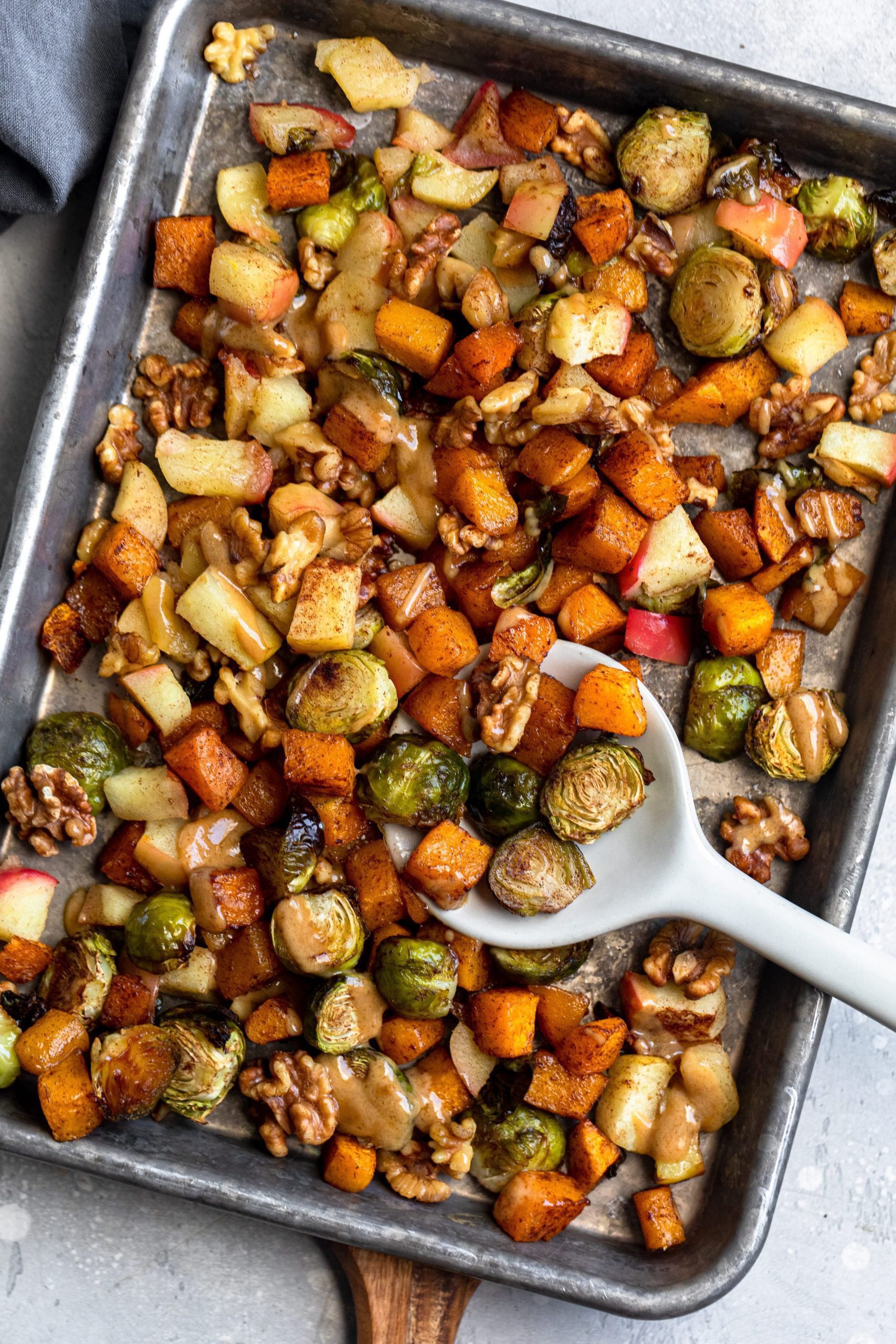Sheet pan butternut squash, brussels sprouts, apples and walnuts with maple mustard sauce