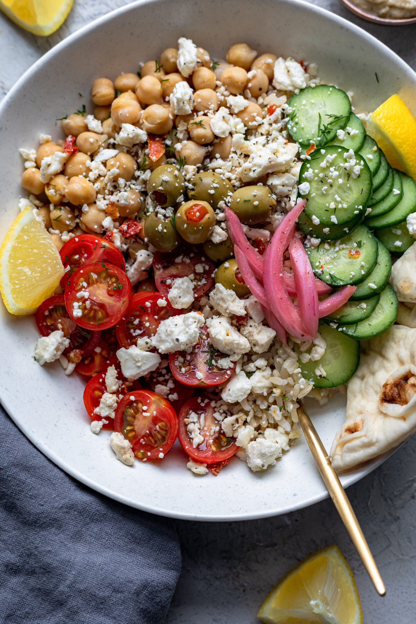 Close up of Greek salad bowls with chickpeas and feta.