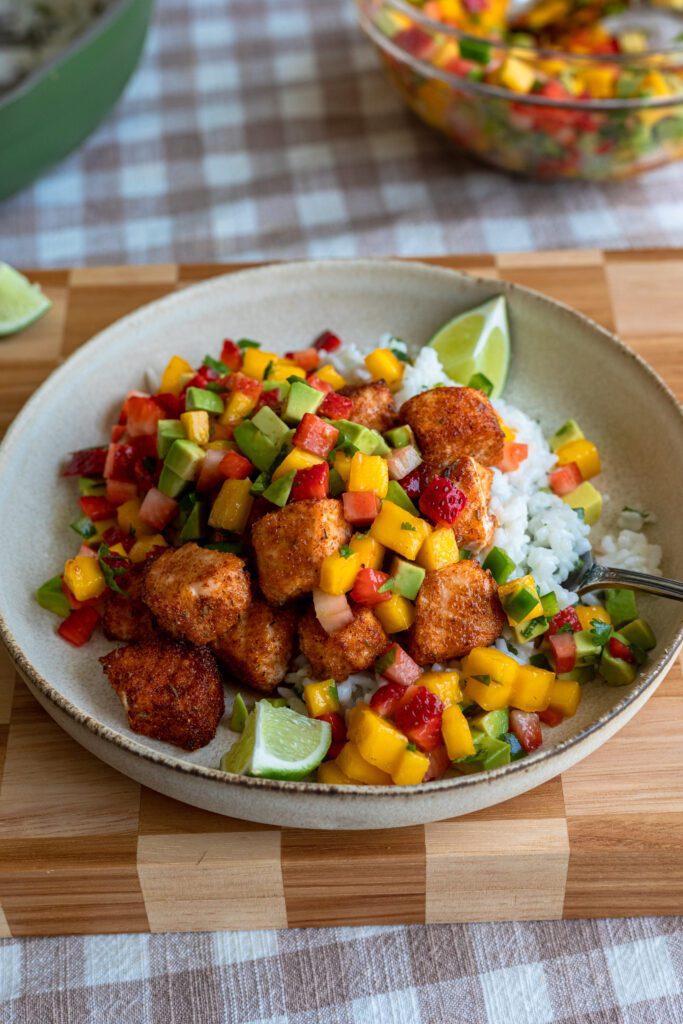 These air fryer salmon bites with strawberry mango avocado salsa on top of coconut lime rice is such a refreshing spring or summer meal!